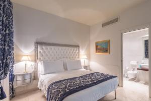 威尼斯艾尔巴洛狄酒店客房内的一张或多张床位