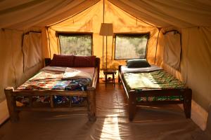 Red Rocks Rwanda - Campsite & Guesthouse客房内的一张或多张床位