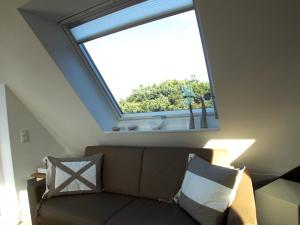 万根沃格Living-art的带沙发和窗户的天窗