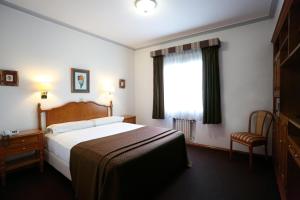 Hotel Riogrande - Habilitado客房内的一张或多张床位