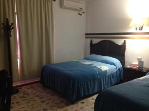Hotel Claudia客房内的一张或多张床位