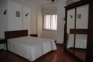 Hotel Peninsular- Porto客房内的一张或多张床位