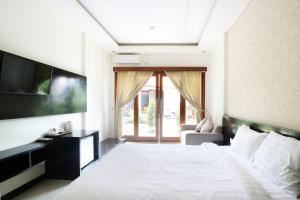 乌玛潘达瓦别墅度假村客房内的一张或多张床位