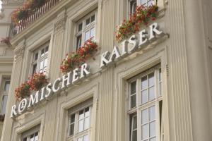 特里尔Hotel Römischer Kaiser的花房边的标志