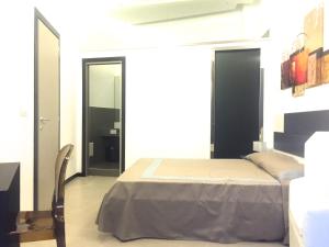 Residenza Santa Lù B&B客房内的一张或多张床位