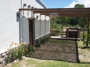 塔菲德尔瓦勒Cabañas Wasi Mayu的院子里带烧烤架的凉棚