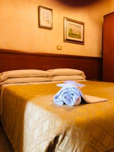 Hotel Casarola - Trigoria客房内的一张或多张床位