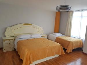 Le Prince Apart Tacna客房内的一张或多张床位