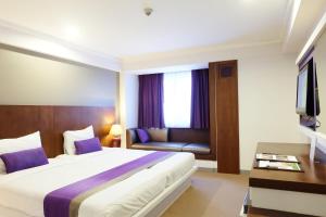 Star Hotel Chiang Mai - SHA Extra Pus客房内的一张或多张床位