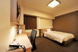 东京湾浜松町散库格兰德酒店客房内的一张或多张床位