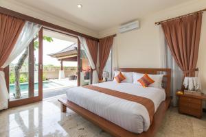 巴厘岛纳基纱里德维纳别墅客房内的一张或多张床位