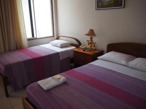 Hotel Peru Amazonico客房内的一张或多张床位