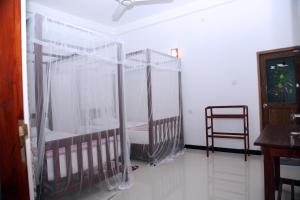 Gihan Guesthouse客房内的一张或多张床位