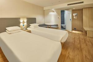 格林东方聊城开发区东昌东路酒店客房内的一张或多张床位