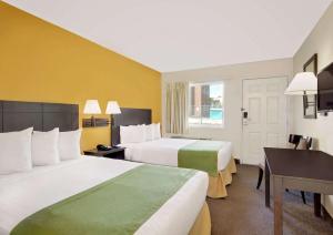 多皮卡那豪生酒店客房内的一张或多张床位