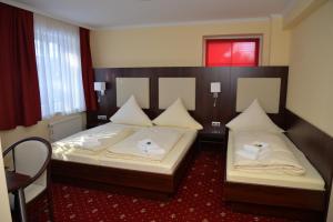 诺格拉本呢尔霍夫酒店客房内的一张或多张床位