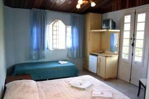 Pousada Bariloche客房内的一张或多张床位