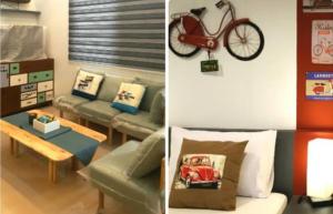 爱妮岛Bayview Country Inn El Nido的客厅配有沙发,墙上有自行车
