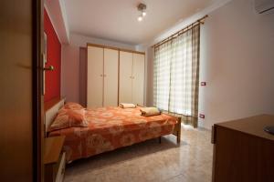 Colapesce Appartamento客房内的一张或多张床位