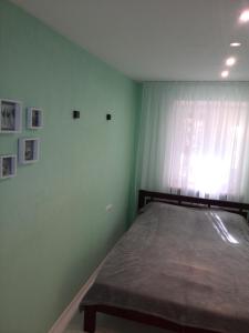 Comfort Apartment on Bogoyavlenskiy客房内的一张或多张床位