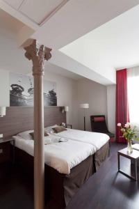 圣艾蒂安城市阁楼公寓式酒店客房内的一张或多张床位