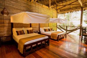 Refugio Amazonas Lodge客房内的一张或多张床位