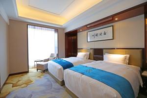 西安蓝溪国际酒店客房内的一张或多张床位