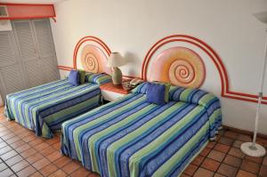 Hotel Caracoles客房内的一张或多张床位
