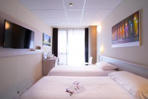 都灵理工大学最佳品质酒店客房内的一张或多张床位