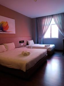 柠檬8号精品酒店@马六甲客房内的一张或多张床位
