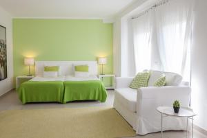 奥卡特鲁斯酒店客房内的一张或多张床位