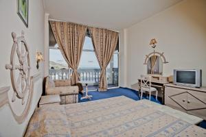 Royal Park Hotel - All Inclusive客房内的一张或多张床位