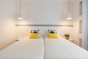 MalagaSuite Premium Deluxe Alameda客房内的一张或多张床位