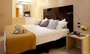 Hotel Residence Ristorante Ramandolo客房内的一张或多张床位