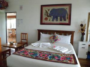 塔架梅西亚酒店客房内的一张或多张床位