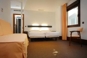 则卡多瓦广场多莫斯酒店客房内的一张或多张床位