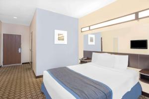 圣安吉洛麦克罗特客栈及套房酒店客房内的一张或多张床位