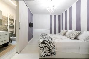 Resilienza Tropical Apartments & Room客房内的一张或多张床位