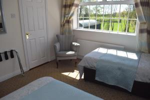 Orchard Grove bed & breakfast R21RC58客房内的一张或多张床位