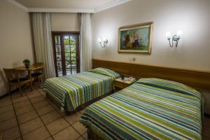 卡特萨巴度假酒店客房内的一张或多张床位
