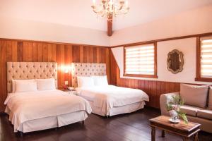 芬卡莱里达咖啡种植园和精品酒店客房内的一张或多张床位