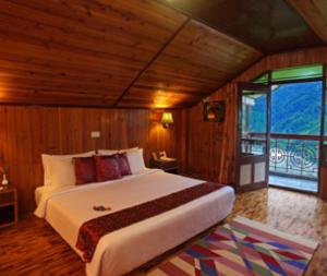 甘托克马辛德拉俱乐部度假村客房内的一张或多张床位