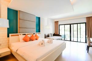 Krabi Tipa Resort - SHA EXTRA PLUS客房内的一张或多张床位