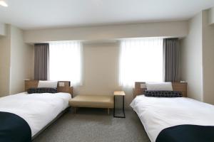 名古屋站贾斯特尊贵酒店客房内的一张或多张床位