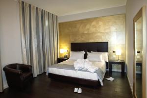 迪莫拉德尔巴索酒店客房内的一张或多张床位
