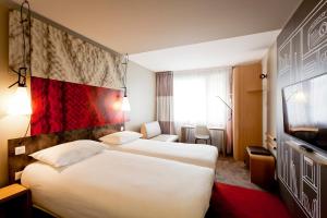 ibis Lyon Carre De Soie客房内的一张或多张床位