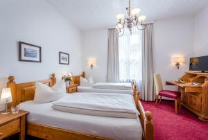 宁芬堡斯加罗斯兰蒙酒店客房内的一张或多张床位
