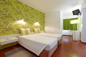 普拉亚多拉达酒店客房内的一张或多张床位