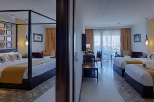 Allegro Hoi An . A Little Luxury Hotel & Spa客房内的一张或多张床位