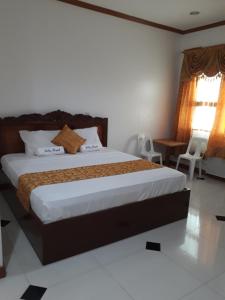 NabasAndres Resort的一间卧室,卧室内配有一张大床
